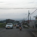 some cars in a little town...and a dirt bike too